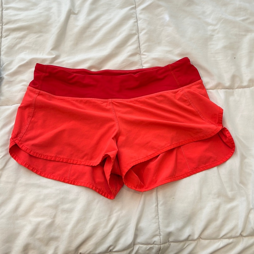 Red orange lululemon speed shorts 2.5 in inseam.
